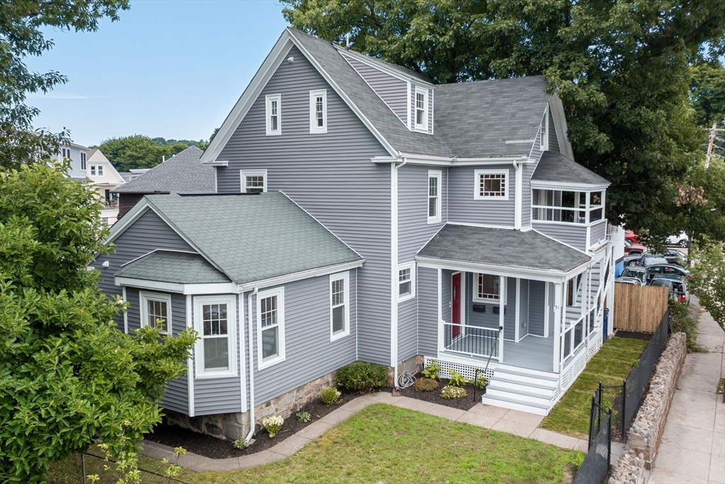 a aerial view of a yard in front of house