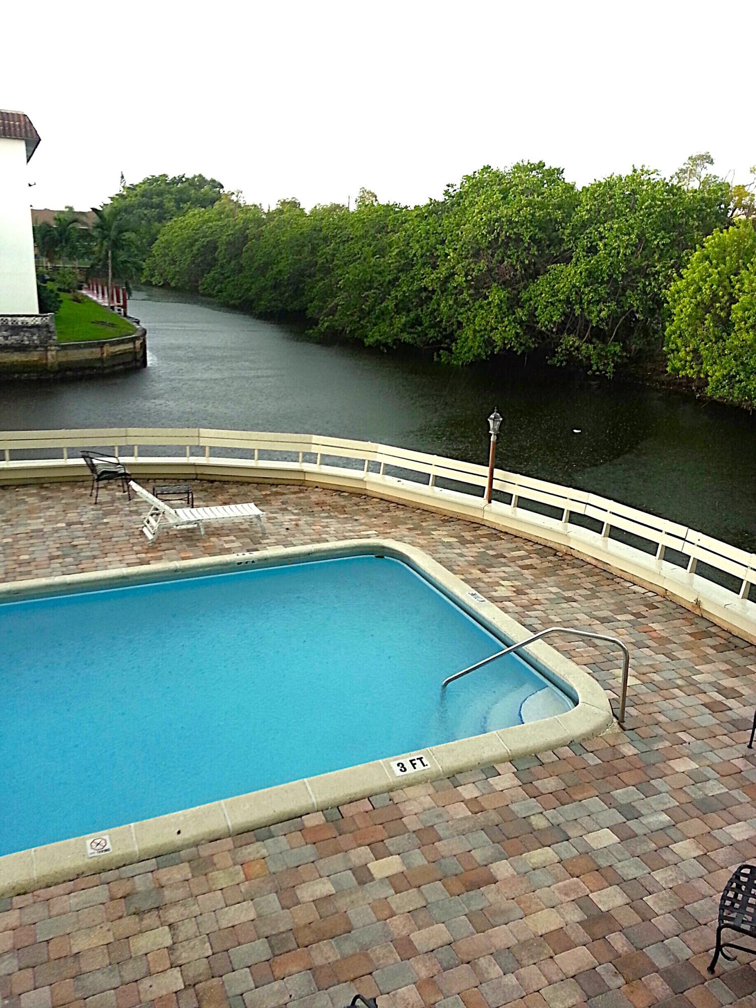 a view of a lake with a yard