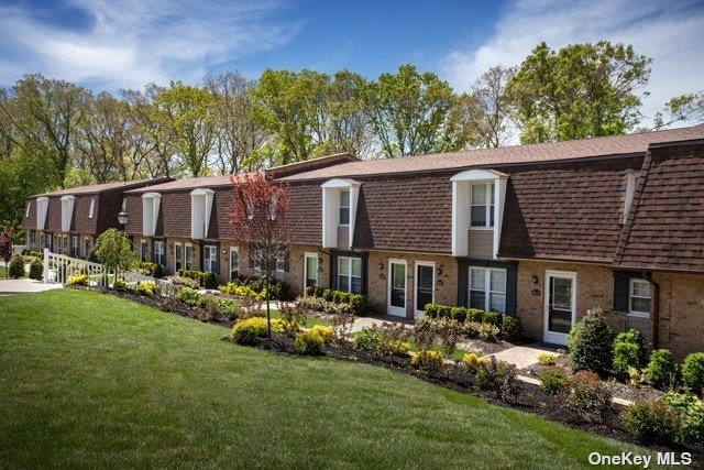 front view of a house with a garden