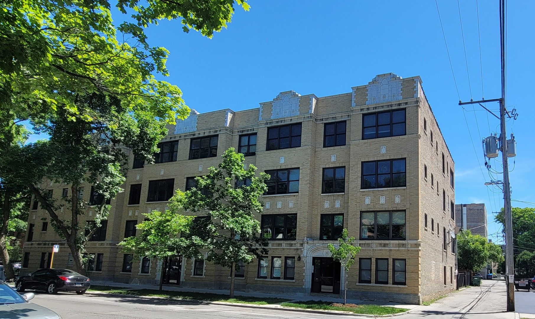 a front view of a building with street view