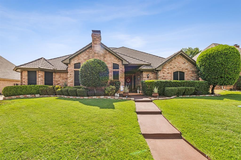 a front view of a house with yard