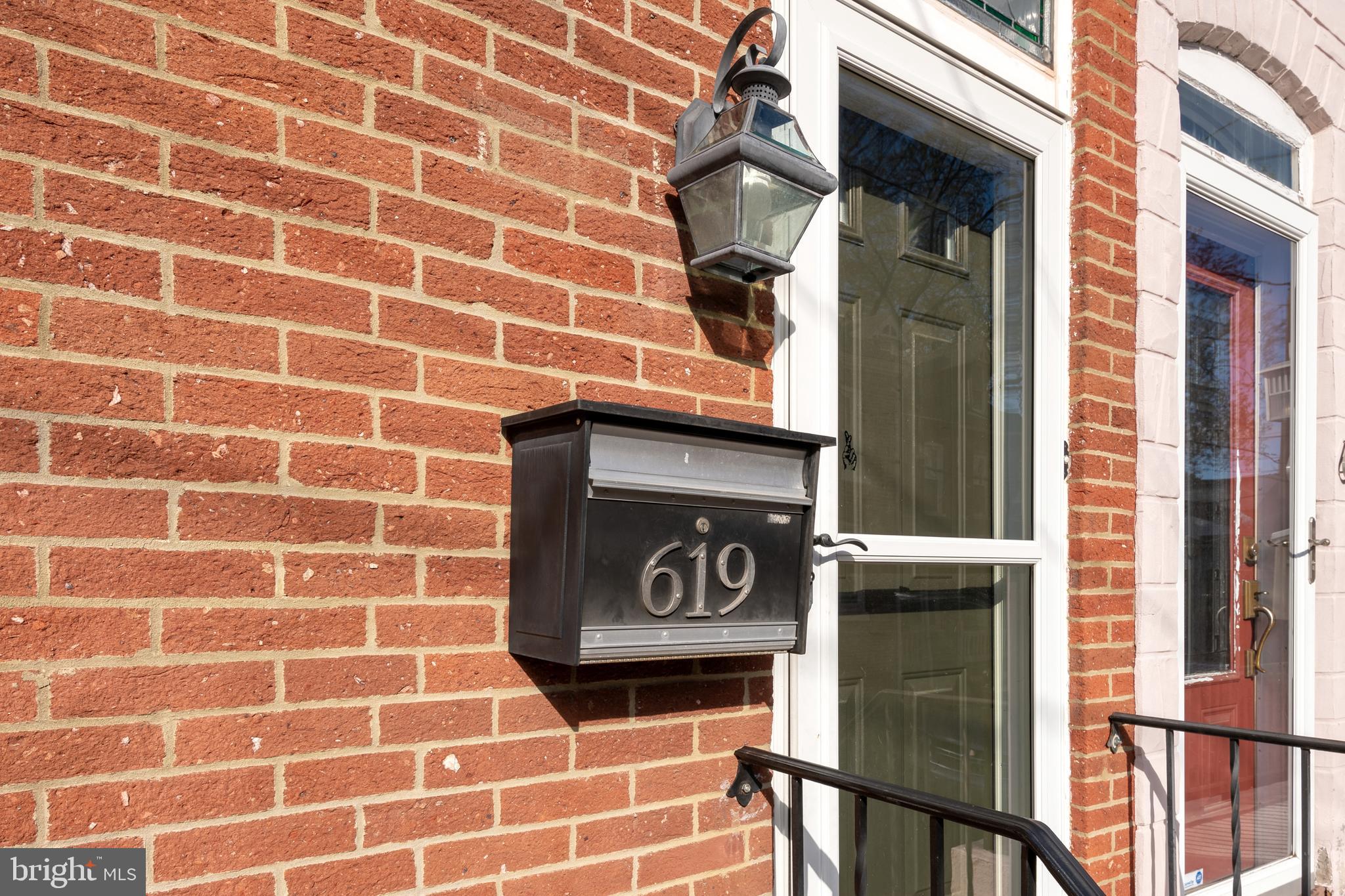 a brick building with a street sign on it