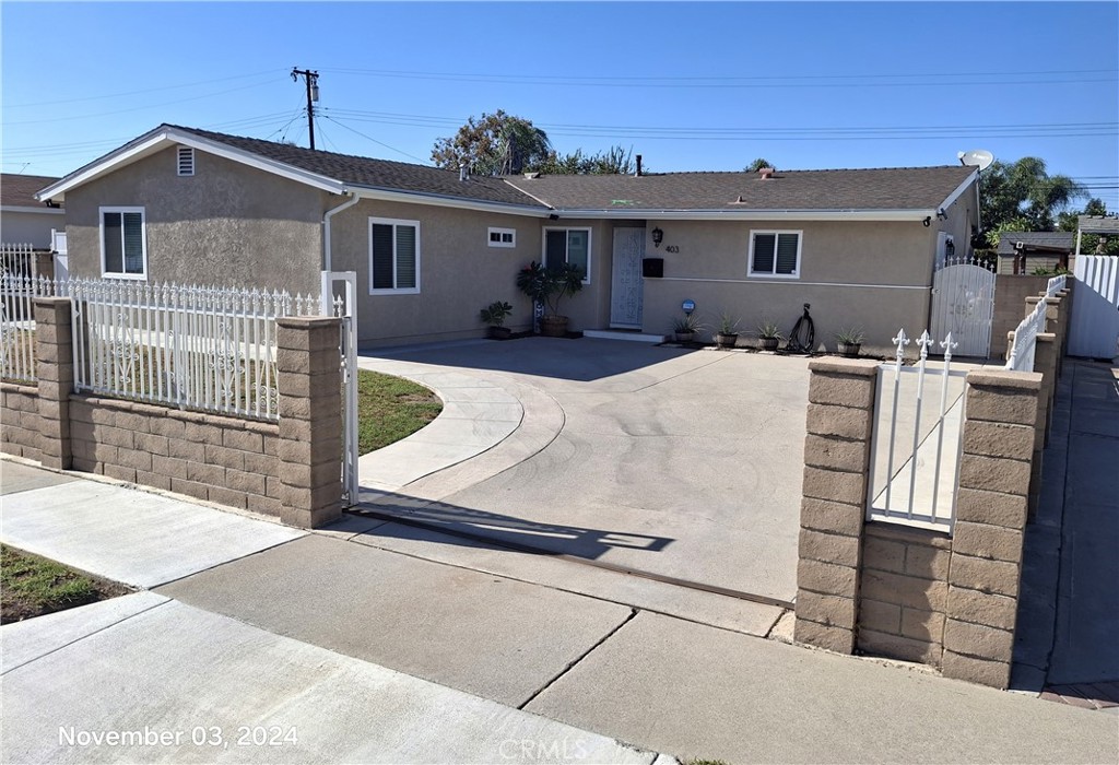 a front view of a house with yard