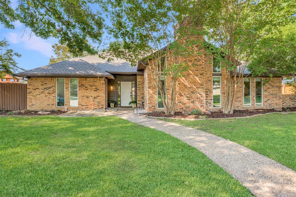 front view of a house with a big yard