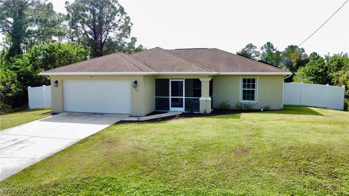 a view of a house with backyard and garden