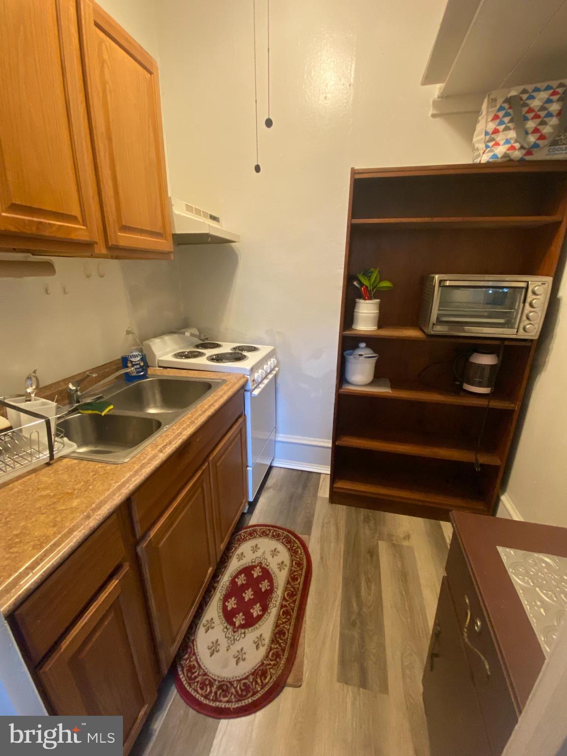 a kitchen with a stove and a sink