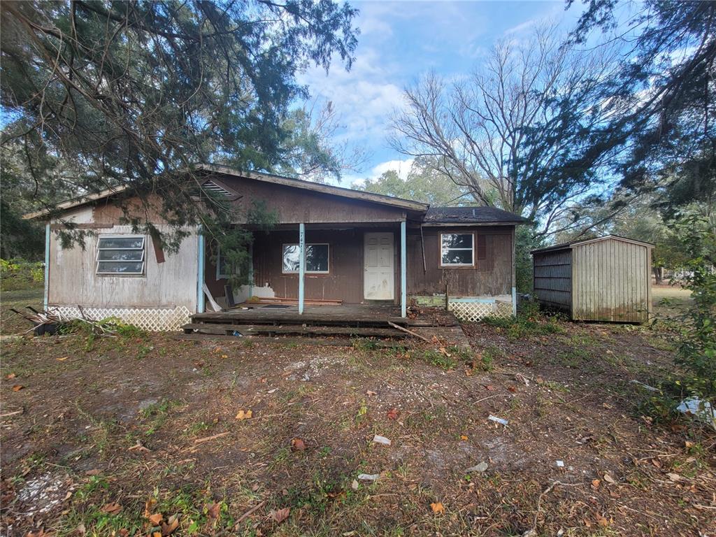 a house with trees in the background