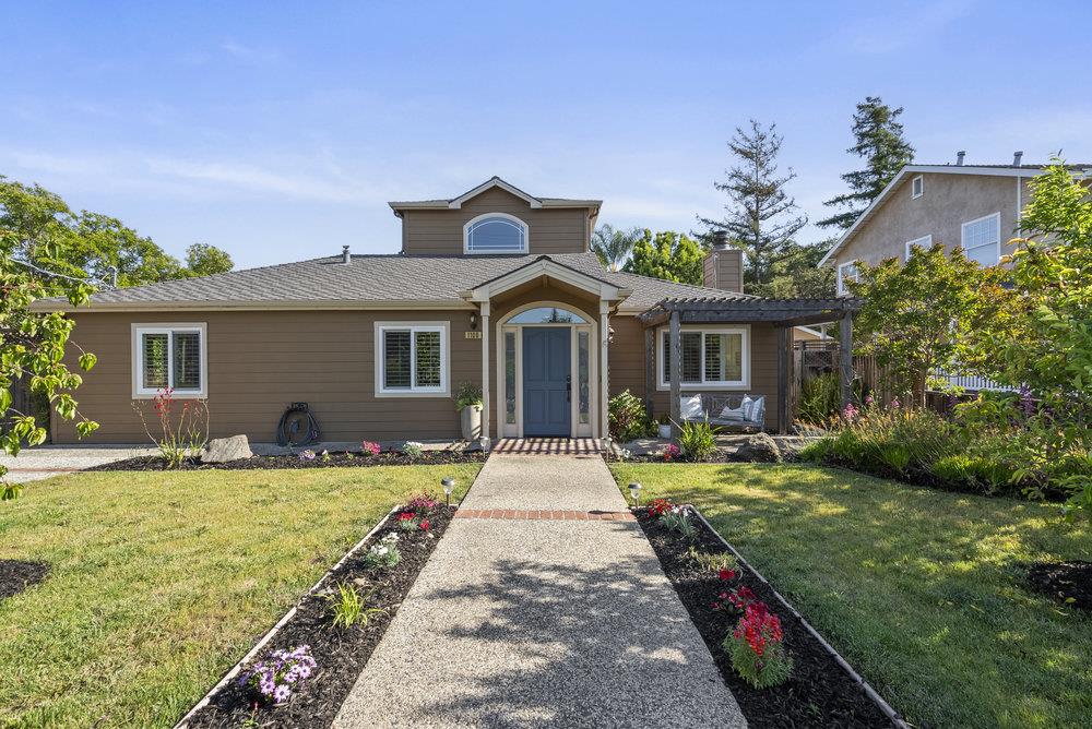 a front view of a house with garden