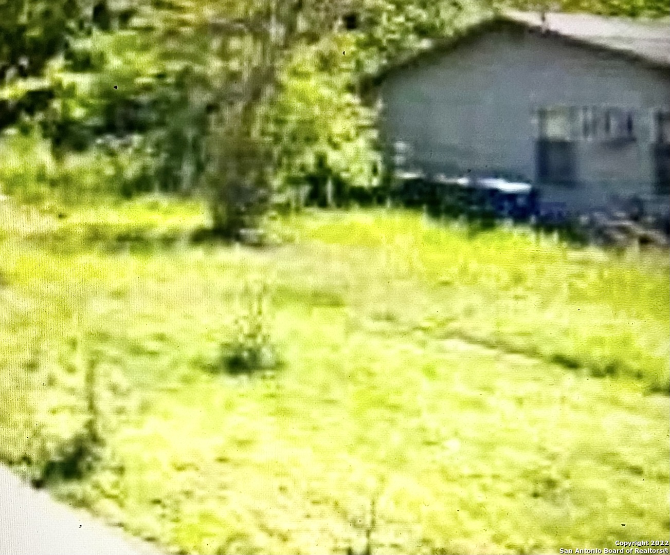 a view of swimming pool with a yard