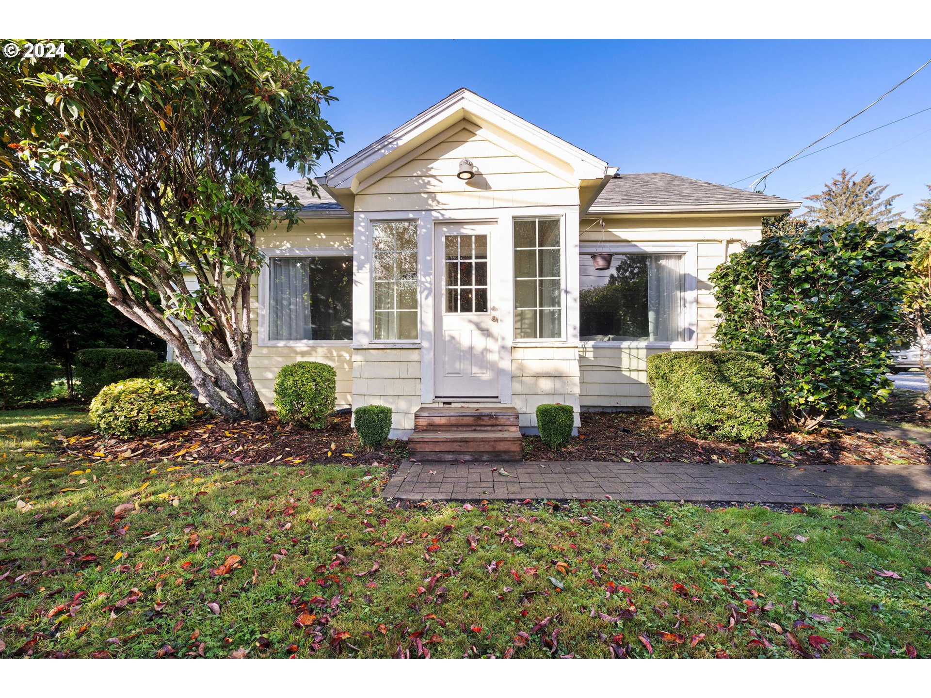 a front view of a house with garden