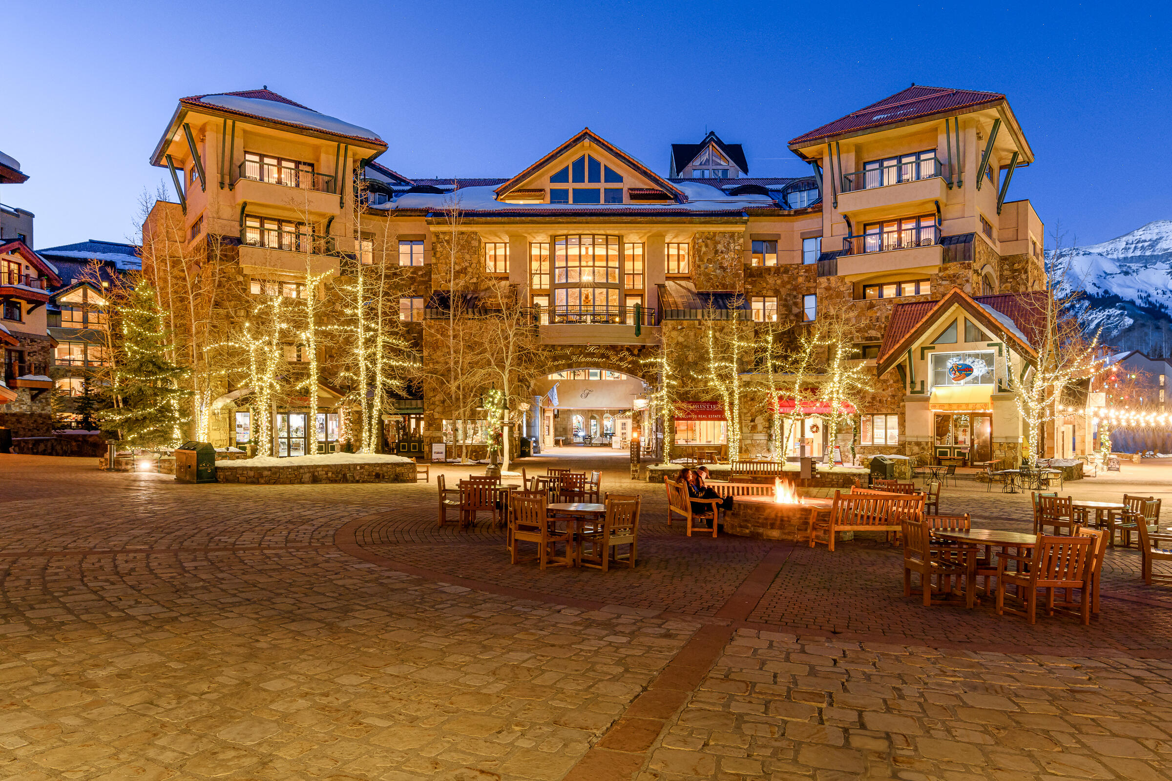 a view of a building with cars parked