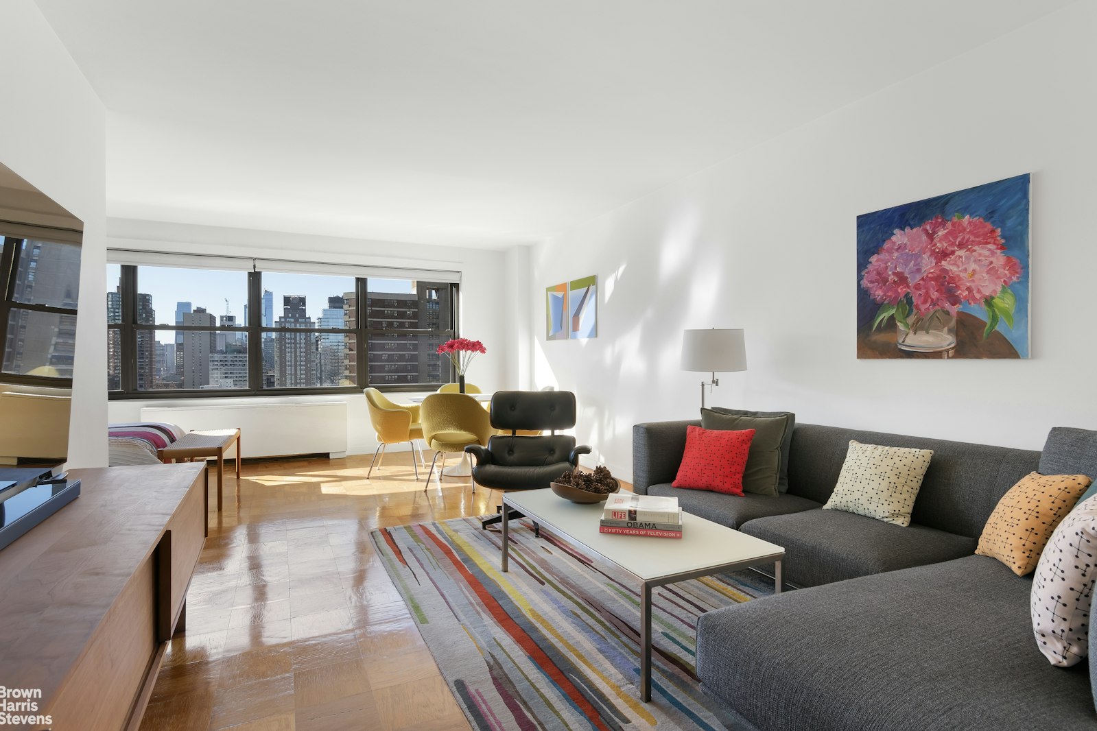 a living room with furniture and a large window