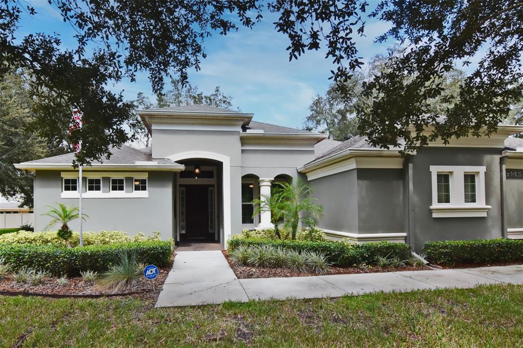 front view of a house with a yard