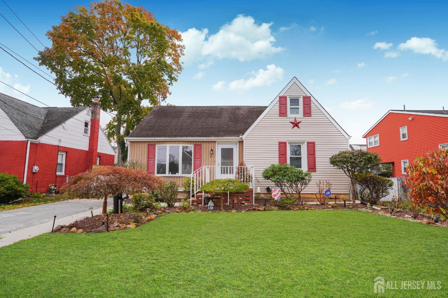 a front view of house with yard and outdoor seating