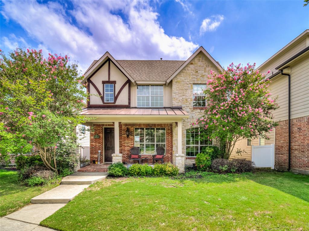 front view of a house with a yard