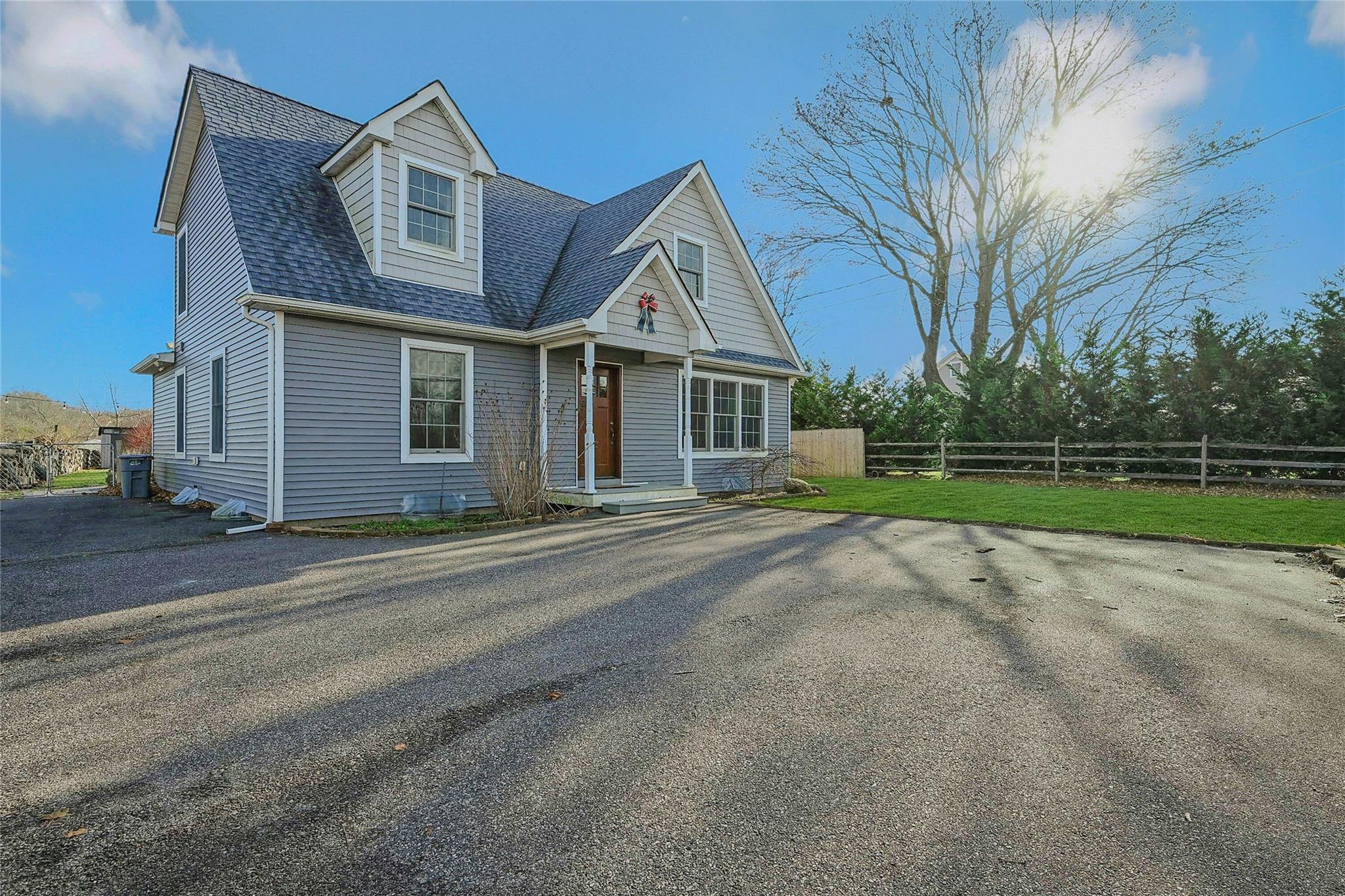 front view of a house with a yard