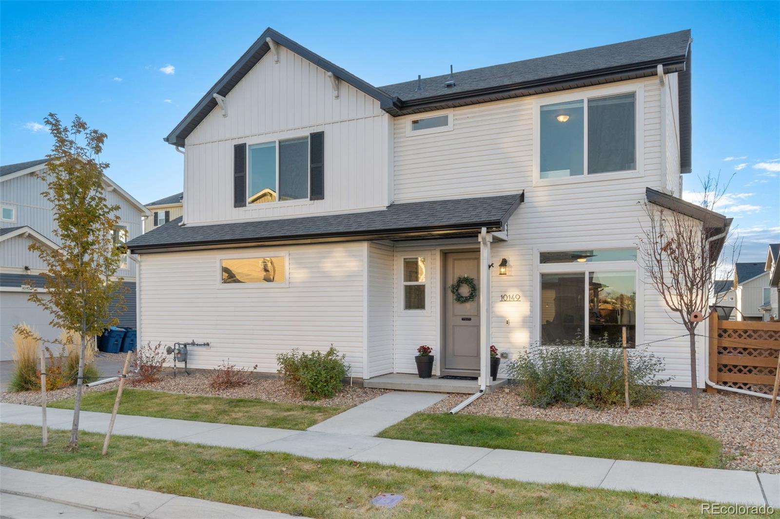 a front view of a house with a yard