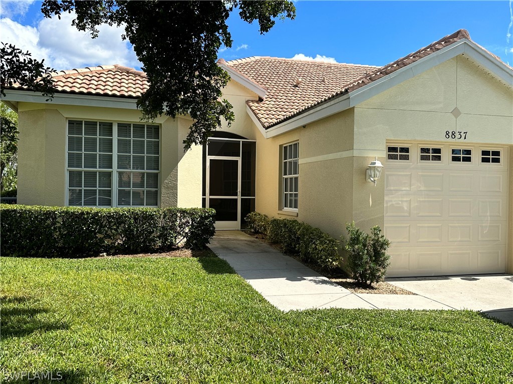 a view of a house with a yard