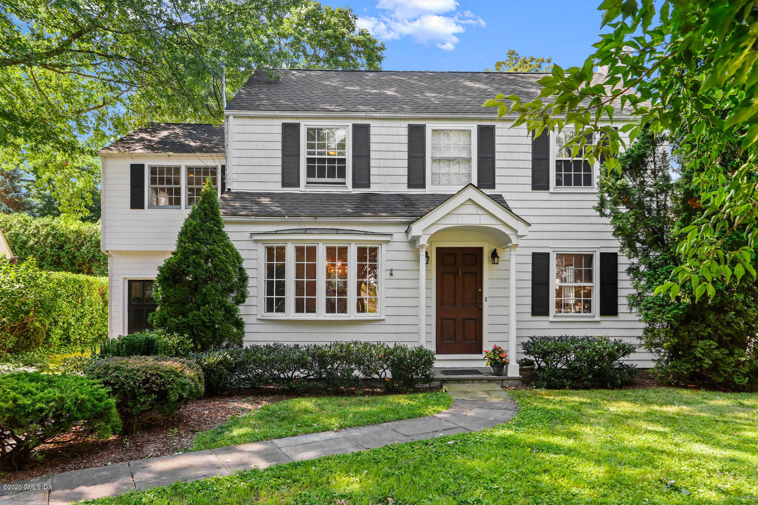 front view of a house with a yard