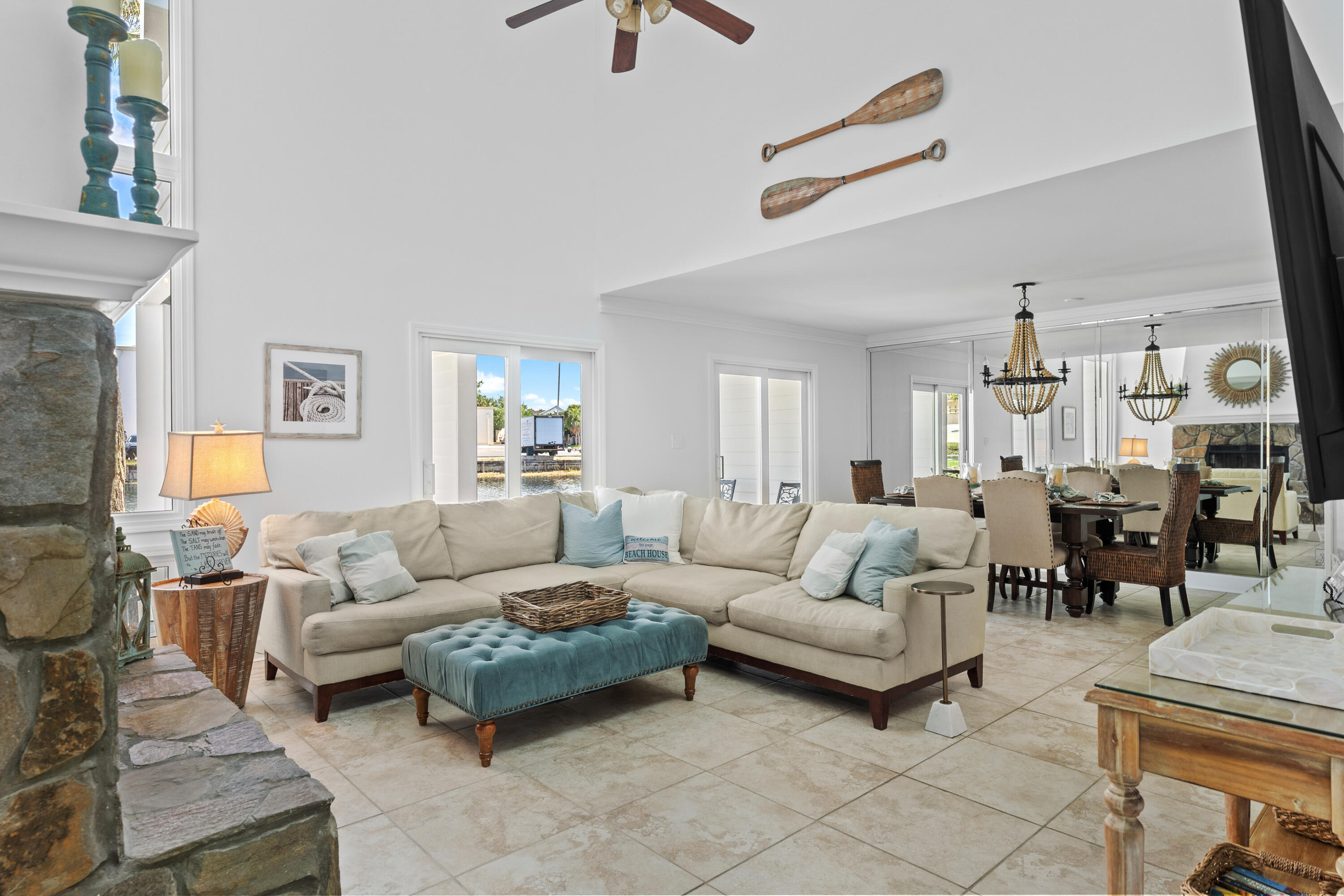 a living room with furniture and a chandelier