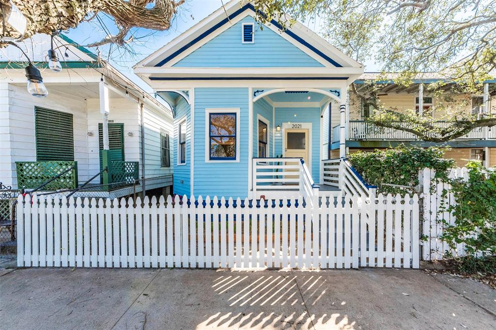 a front view of a house with a fence