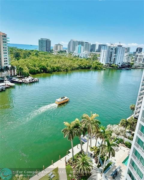 a view of a lake with a house in the background