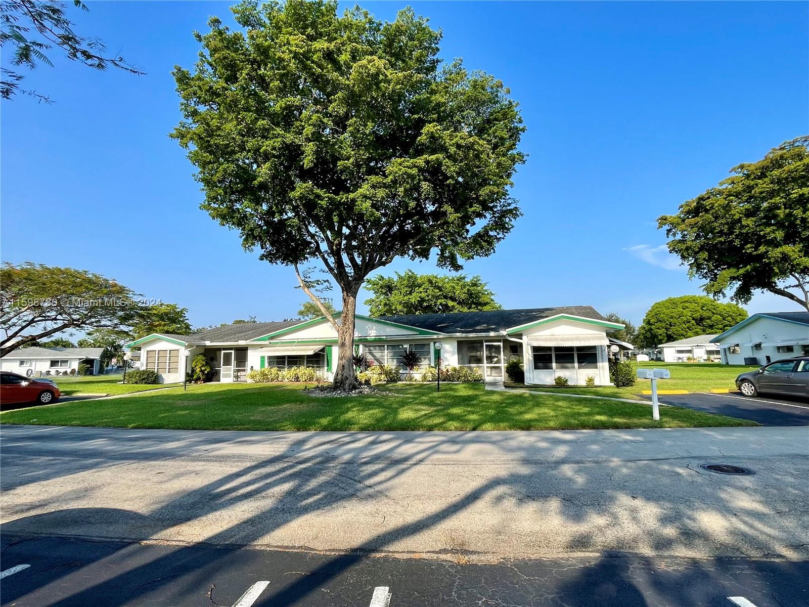 a front view of a building with street view