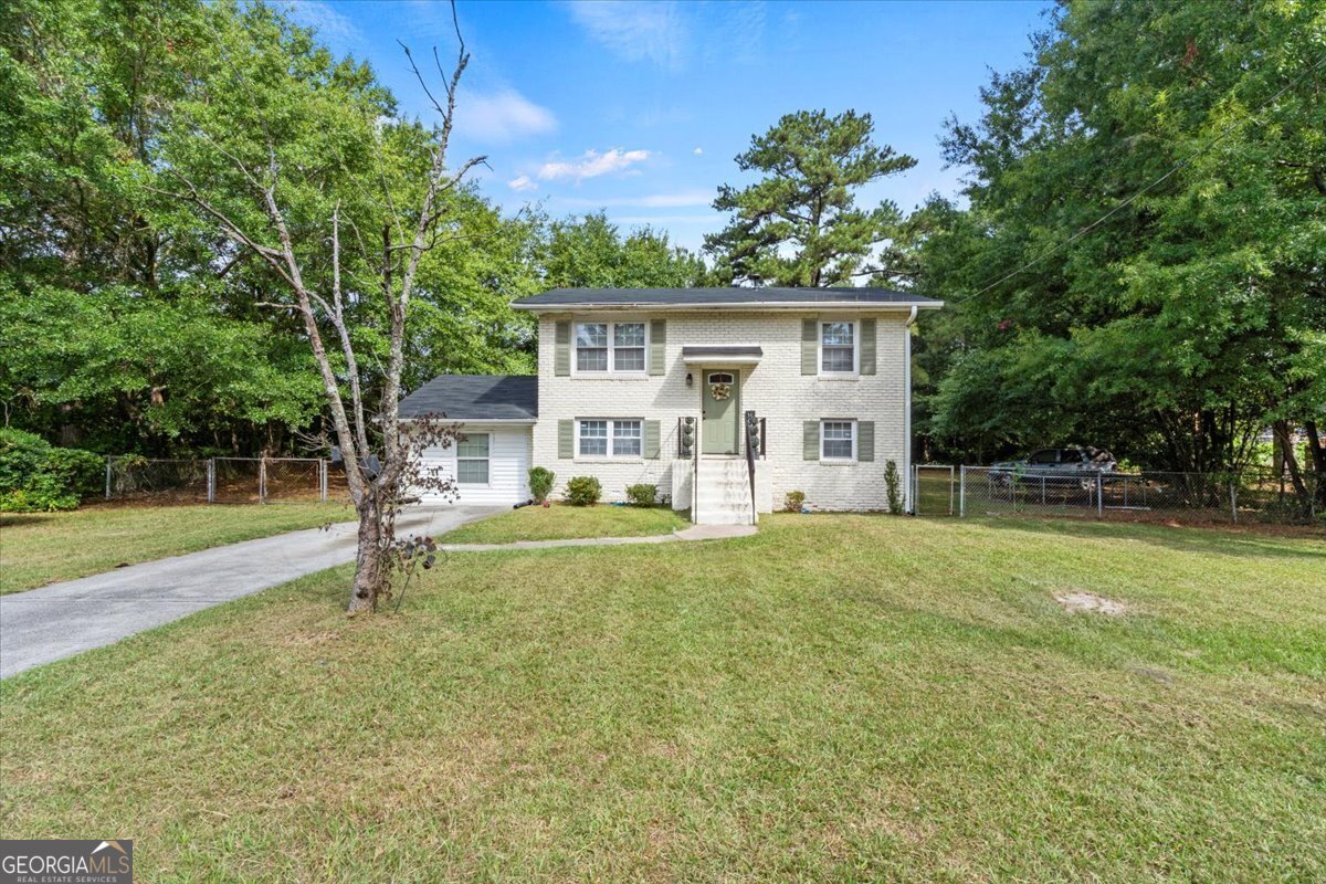 front view of a house with a yard