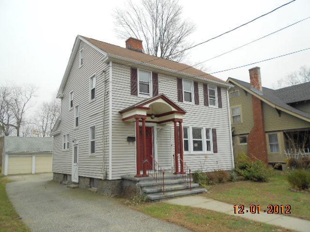 a front view of a house with a garage