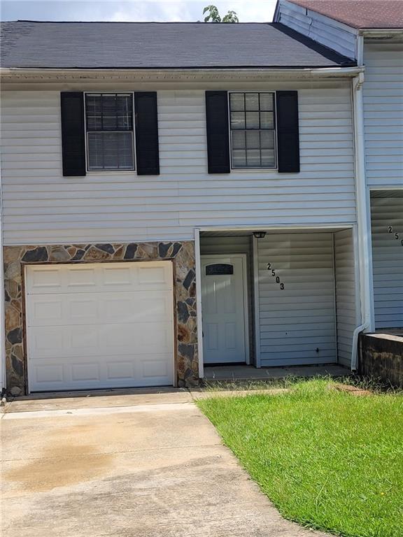 a view of a house with a yard