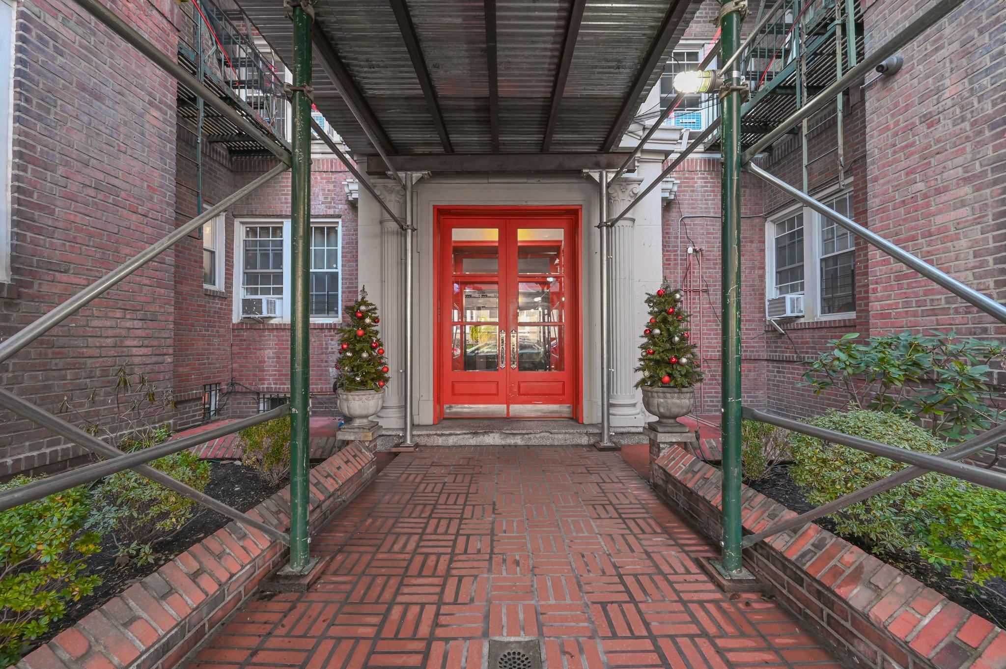 a view of a porch with wooden floor and stairs