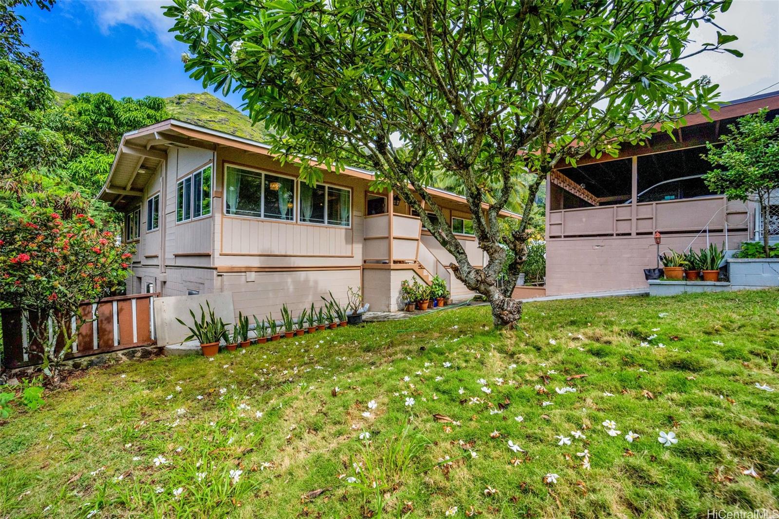 a view of front of house with a yard