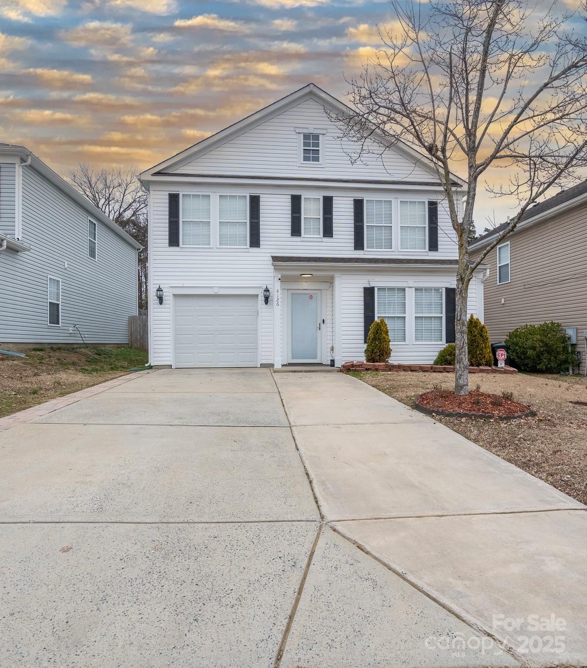 a front view of a house with a garage