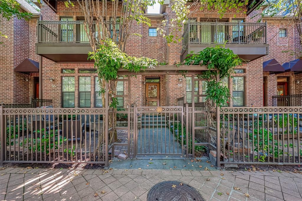 a view of a house with a garden and plants