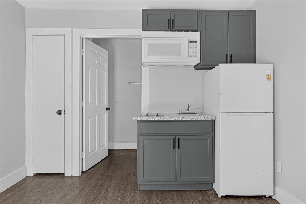 a white refrigerator freezer sitting inside of a kitchen