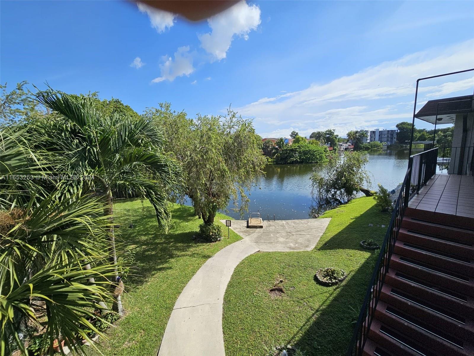 a view of a lake with a yard