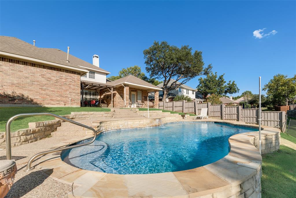 a view of a swimming pool with a patio