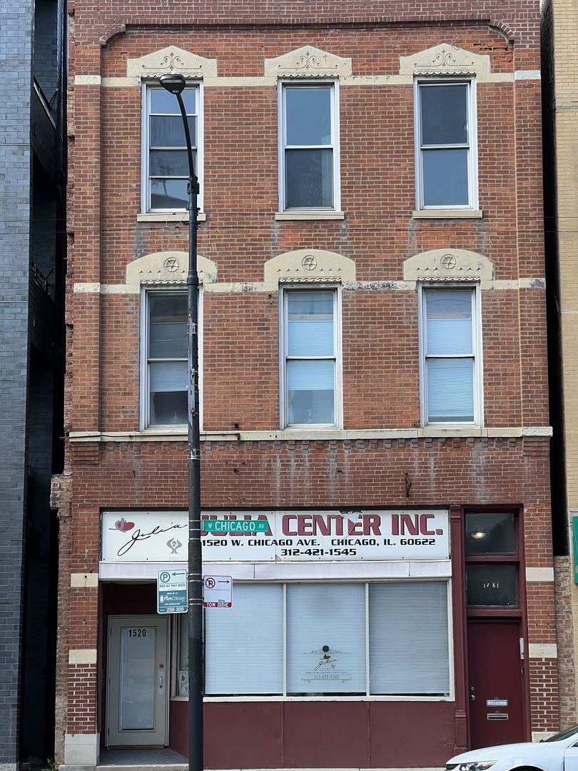 a street sign on a brick building