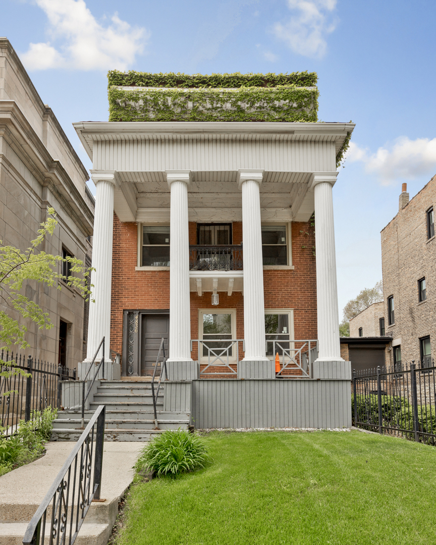 front view of a house with a yard