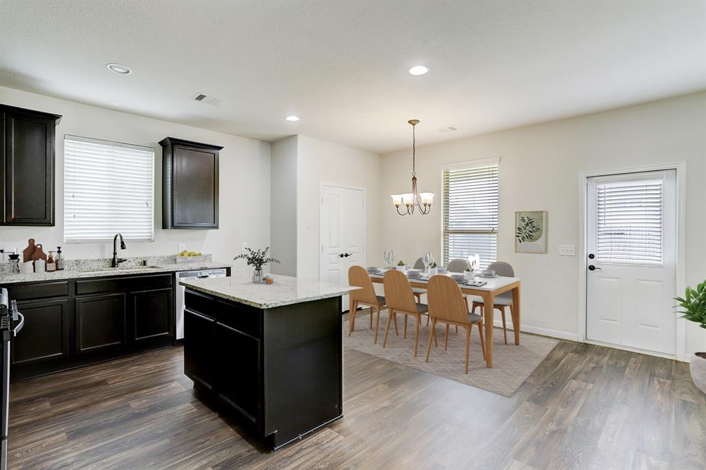 Open Floor plan to dining and living from the kitchen to enjoy the family game