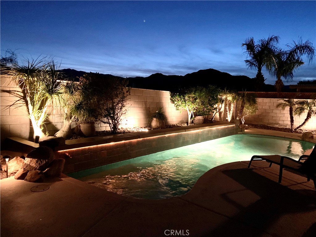 a view of swimming pool from a balcony