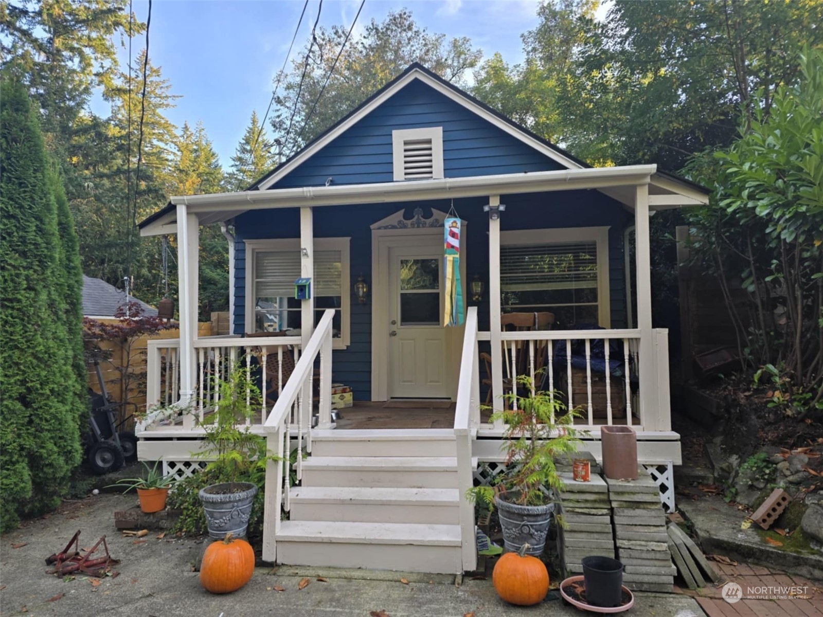 a view of a house with porch and furniture