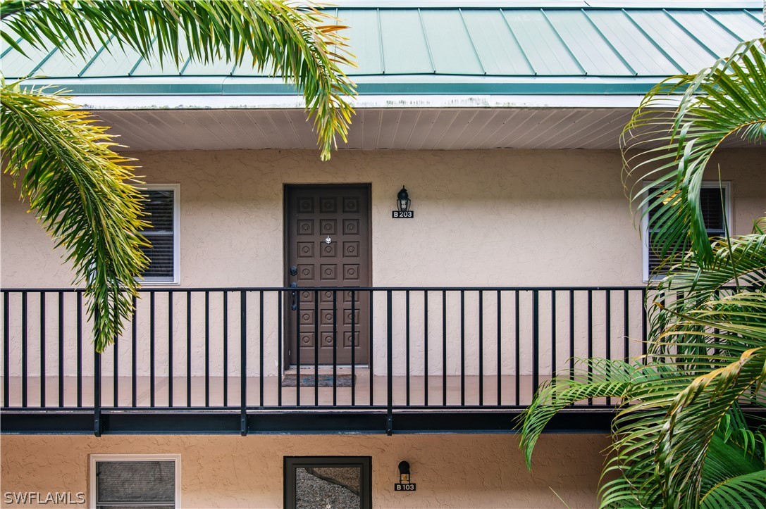 a view of balcony with a potted plant