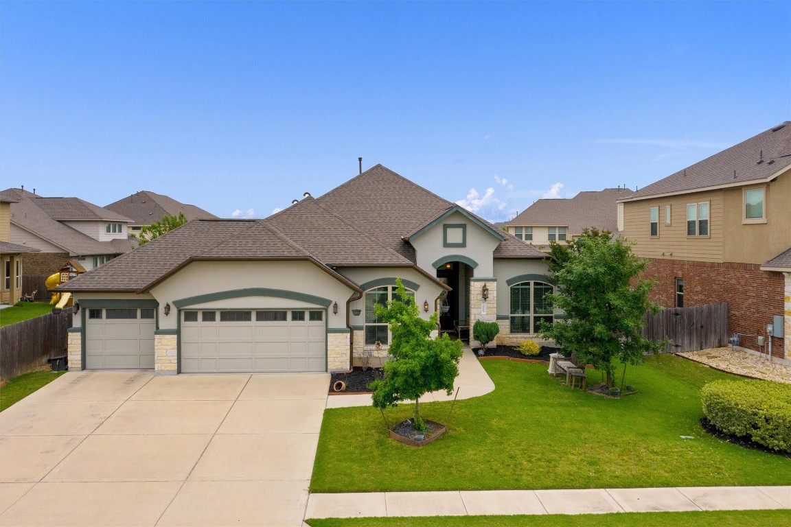 a front view of a house with a yard