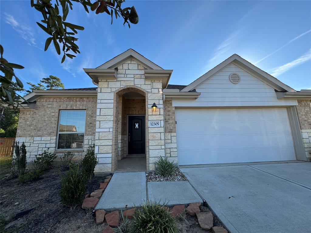 a front view of a house with garage