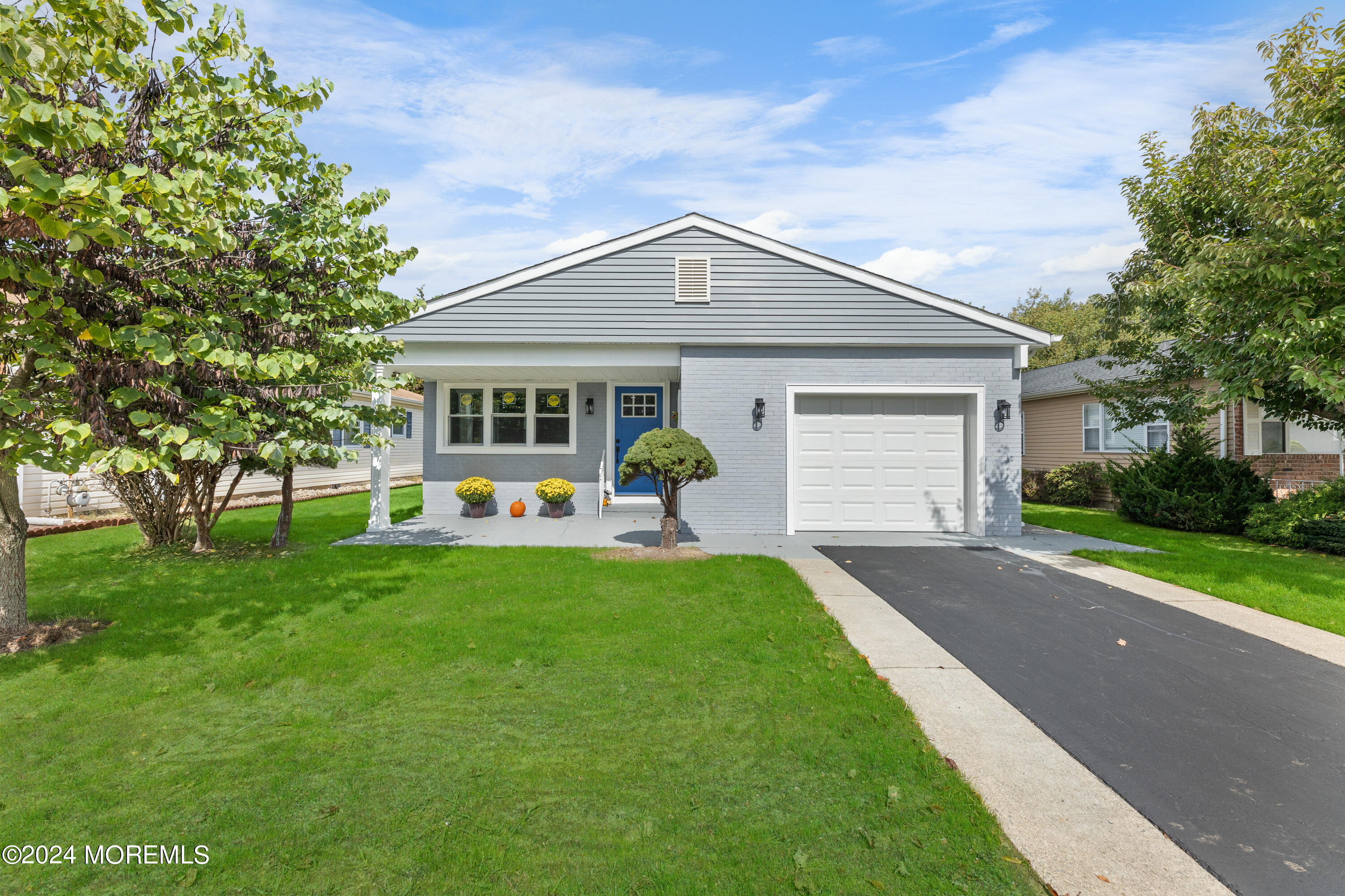 front view of a house with a yard