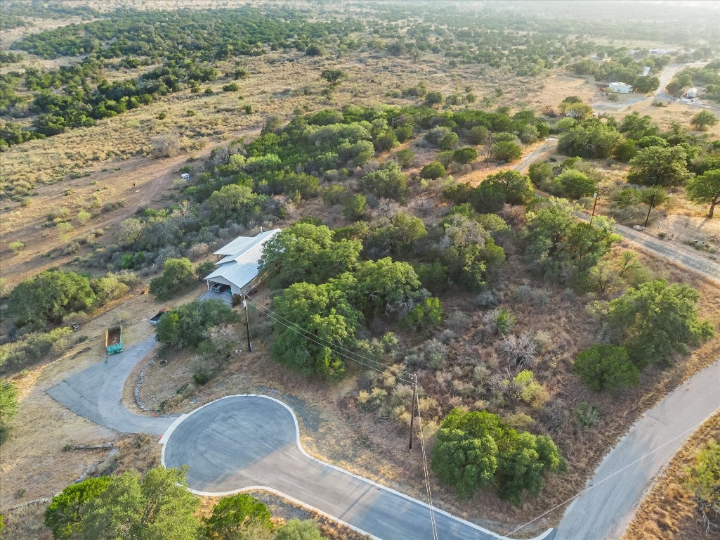 an aerial view of houses with yard