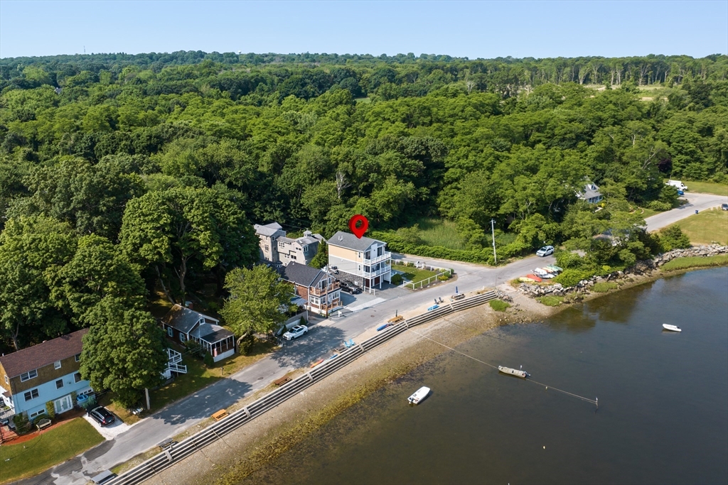 an aerial view of a house with a yard