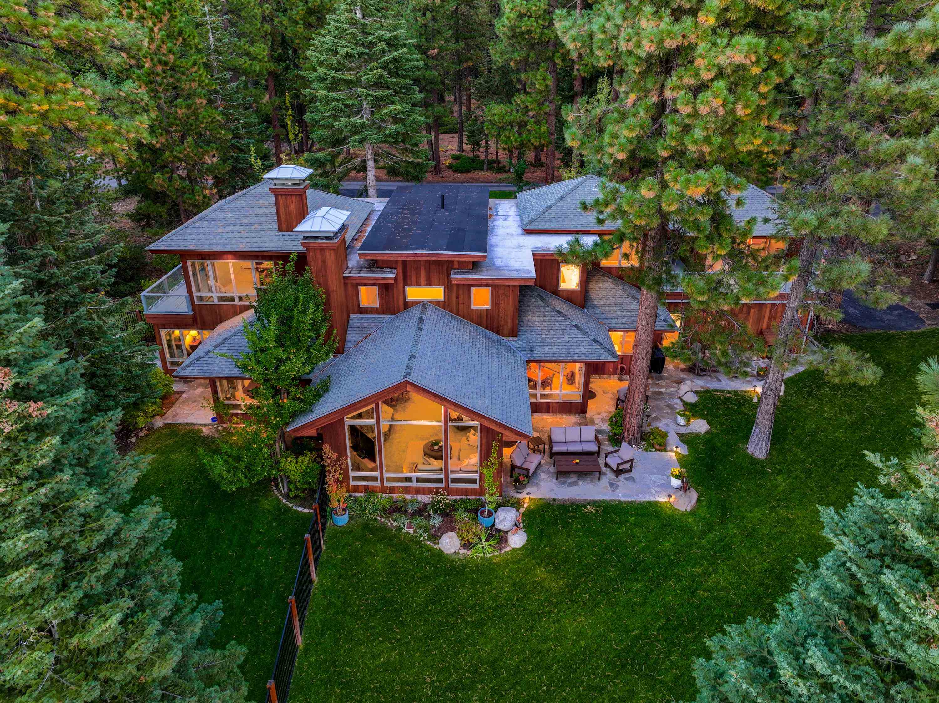 Gorgeous home set atop a ridge overlooking the sparkling Gem of the Sierras, Lake Tahoe with pier.