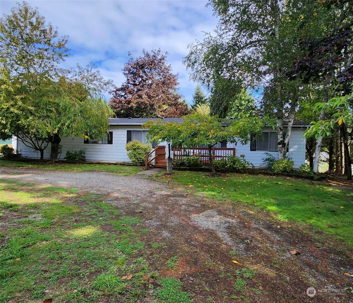 a view of house with backyard space and garden